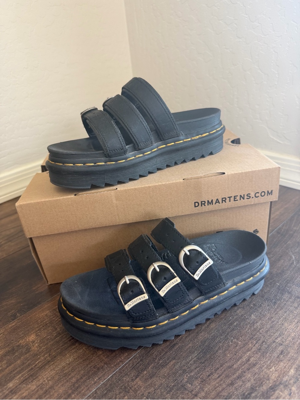 Dr. Martens Black Triple-Buckle Platform Slides with Yellow Stitching
